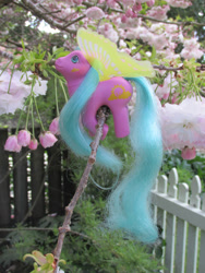 Size: 774x1032 | Tagged: safe, imported from derpibooru, photographer:normaleeinsane, fence, g1, irl, photo, sun glider, toy, tree, windy wing ponies
