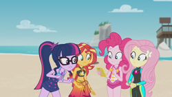 Size: 1920x1080 | Tagged: safe, imported from derpibooru, screencap, fluttershy, pinkie pie, sci-twi, sunset shimmer, twilight sparkle, human, equestria girls, equestria girls series, unsolved selfie mysteries, bare shoulders, beach, belly button, bikini, bikini top, cellphone, clothes, female, fluttershy's wetsuit, geode of empathy, geode of fauna, geode of sugar bombs, geode of telekinesis, glasses, hairpin, magical geodes, one-piece swimsuit, phone, pinkie pie swimsuit, ponytail, sarong, sci-twi swimsuit, sleeveless, smartphone, swimsuit, water, wetsuit