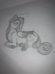 Size: 3024x4032 | Tagged: safe, artist:lotustrails, imported from derpibooru, fluttershy, pegasus, pony, flower, flower in hair, grayscale, lying down, monochrome, pencil drawing, solo, traditional art