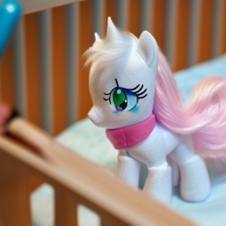 Size: 512x512 | Tagged: safe, imported from derpibooru, ai content, ai generated, crib, foal, generator:stable diffusion, photo, plushie, solo