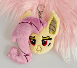 Size: 1077x956 | Tagged: safe, artist:meplushyou, imported from derpibooru, fluttershy, bat pony, bat ponified, charm, fangs, flutterbat, keychain, plushie, race swap, smiling, solo