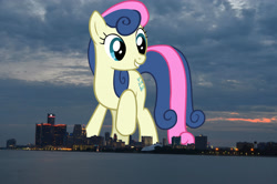 Size: 2047x1356 | Tagged: safe, artist:jaredking779, artist:scrimpeh, imported from derpibooru, bon bon, sweetie drops, earth pony, pony, background pony, detroit, female, giant bon bon (sweetie drops), giant pony, giant/macro earth pony, giantess, highrise ponies, irl, macro, mare, mega bon bon, mega giant, michigan, photo, ponies in real life
