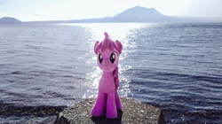 Size: 1024x572 | Tagged: safe, imported from derpibooru, photographer:pakapaka1993, berry punch, berryshine, earth pony, pony, irl, japan, mountain, ocean, photo, plushie, rock, solo, water