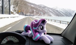 Size: 2048x1225 | Tagged: safe, imported from derpibooru, photographer:pakapaka1993, starlight glimmer, pony, unicorn, car, car interior, irl, japan, photo, plushie, snow, solo, tongue out, winter