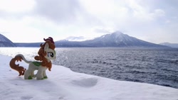 Size: 2048x1152 | Tagged: safe, imported from derpibooru, photographer:pakapaka1993, autumn blaze, kirin, pony, irl, japan, mountain, ocean, photo, plushie, snow, solo, water, winter