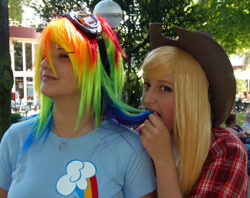 Size: 1080x857 | Tagged: safe, artist:tifachronicles, artist:yo-cosplay, imported from derpibooru, applejack, rainbow dash, human, 2012, clothes, cosplay, costume, cowboy hat, goggles, hat, irl, irl human, multicolored hair, photo, rainbow hair