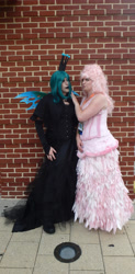 Size: 1718x3490 | Tagged: safe, artist:flufflepam, imported from derpibooru, queen chrysalis, oc, oc:fluffle puff, human, brick wall, clothes, cosplay, costume, duo, irl, irl human, photo