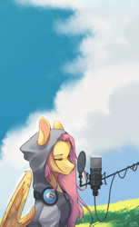 Size: 1280x2093 | Tagged: safe, artist:rladsenpai, imported from derpibooru, fluttershy, pegasus, pony, clothes, cloud, female, grass, grass field, headphones, hoodie, lidded eyes, looking at something, mare, microphone, outdoors, partially open wings, pop filter, rainbow dash's cutie mark, sitting, sky, solo, three quarter view, vertical, wings