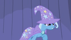 Size: 1280x720 | Tagged: safe, imported from derpibooru, screencap, trixie, pony, unicorn, boast busters, season 1, brooch, cape, clothes, female, gritted teeth, hat, jewelry, mare, raised hoof, solo, trixie is not amused, trixie's brooch, trixie's cape, trixie's hat, unamused