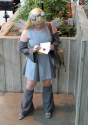 Size: 960x1362 | Tagged: safe, artist:rivenchan, imported from derpibooru, derpy hooves, human, 2011, clothes, cosplay, costume, emerald city comicon, irl, irl human, leg warmers, letter, photo