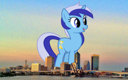 Size: 2000x1260 | Tagged: safe, artist:90sigma, artist:thegiantponyfan, imported from derpibooru, minuette, pony, unicorn, female, florida, giant pony, giant unicorn, giantess, highrise ponies, irl, jacksonville, macro, mare, mega giant, mega/giant minuette, multicolored mane, multicolored tail, open mouth, open smile, photo, ponies in real life, smiling, tail