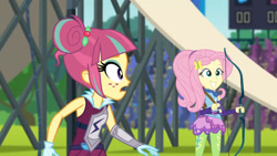 Size: 3410x1920 | Tagged: safe, imported from derpibooru, screencap, fluttershy, sour sweet, equestria girls, friendship games, archery, duo, duo female, eyeshadow, female, grin, hairpin, high res, makeup, sleeveless, smiling