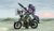 Size: 1087x639 | Tagged: safe, artist:plunger, starlight glimmer, trixie, pony, unicorn, bandana, clothes, duo, eyebrows, female, goggles, grin, hoof hold, horn, mare, messy mane, motorcycle, rpg-7, sitting, smiling, sun, teeth, weapon