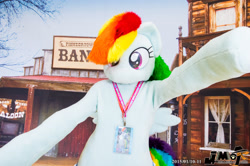 Size: 2000x1330 | Tagged: safe, artist:kuou, imported from derpibooru, rainbow dash, human, pegasus, pony, 2015, arms wide open, clothes, convention, convention:jmof, cosplay, costume, fursuit, irl, irl human, japan, lanyard, no mouth, photo, ponysuit, solo, tail, wild west, wings