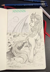 Size: 836x1200 | Tagged: safe, alternate version, artist:taytinabelle, imported from derpibooru, autumn blaze, kirin, cloud, cloudy, female, grayscale, happy, heart, hoof heart, looking left, mare, monochrome, pencil, pencil drawing, photo, rainbow, raised hoof, rear view, sketch, sketchbook, solo, traditional art, underhoof, walking, walking away