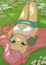 Size: 2480x3508 | Tagged: safe, artist:でかすじ, imported from derpibooru, part of a set, fluttershy, equestria girls, blushing, breasts, busty fluttershy, chamomile, clothes, cute, cutie mark accessory, eyelashes, female, flower, grass, hairclip, high res, long hair, looking at you, lying down, midriff, multiple variants, on back, on ground, outdoors, shirt, shorts, smiling, smiling at you, solo, sunlight, t-shirt, teal eyes