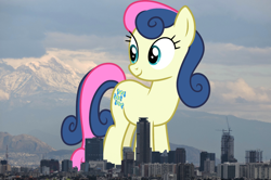 Size: 1280x848 | Tagged: safe, artist:cloudy glow, artist:thegiantponyfan, imported from derpibooru, bon bon, sweetie drops, earth pony, pony, background pony, female, giant bon bon (sweetie drops), giant pony, giant/macro earth pony, giantess, highrise ponies, irl, looking back, macro, mare, mega bon bon, mega giant, mexico, mexico city, photo, ponies in real life, smiling, standing