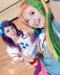 Size: 1080x1350 | Tagged: safe, imported from derpibooru, rainbow dash, rarity, human, clothes, cosplay, costume, cutie mark on clothes, duo, irl, irl human, multicolored hair, peace sign, photo, rainbow hair