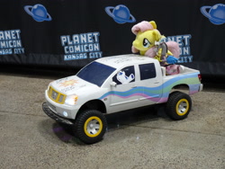Size: 3648x2736 | Tagged: safe, imported from derpibooru, discord, fluttershy, shining armor, draconequus, pegasus, pony, unicorn, 4de, autograph, convention, female, funko, irl, male, nissan, photo, pickup truck, planet comicon, plushie, toy