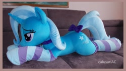 Size: 3952x2248 | Tagged: safe, artist:calusariac, imported from derpibooru, trixie, pony, bow, clothes, irl, life size, lying down, photo, plushie, prone, socks, solo, striped socks, tail, tail bow