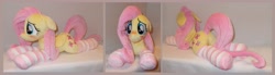 Size: 4572x1264 | Tagged: safe, artist:calusariac, imported from derpibooru, fluttershy, pony, blushing, butt, clothes, floppy ears, irl, lying down, photo, plot, plushie, prone, socks, solo, striped socks