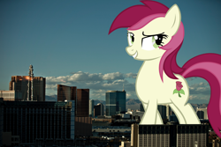 Size: 3240x2160 | Tagged: safe, artist:ocarina0ftimelord, artist:thegiantponyfan, imported from derpibooru, roseluck, earth pony, pony, background pony, female, giant pony, giantess, high res, highrise ponies, irl, las vegas, looking at you, macro, mare, mega giant, nevada, photo, ponies in real life, smiling