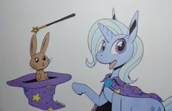 Size: 2048x1321 | Tagged: safe, artist:darkhestur, imported from derpibooru, trixie, pony, rabbit, unicorn, animal, cape, clothes, hat, looking at you, magic trick, magic wand, simple background, smiling, solo, traditional art, trixie's cape, trixie's hat, white background