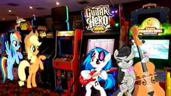 Size: 1465x828 | Tagged: safe, artist:greywolf2021, imported from derpibooru, applejack, dj pon-3, octavia melody, rainbow dash, vinyl scratch, earth pony, pegasus, pony, unicorn, applejack's hat, arcade, bipedal, cello, cowboy hat, electric guitar, female, guitar, guitar hero, hat, irl, mare, musical instrument, photo, ponies in real life