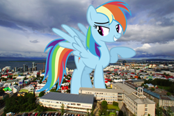 Size: 5700x3800 | Tagged: safe, artist:ashidaru, artist:thegiantponyfan, imported from derpibooru, rainbow dash, pegasus, pony, absurd resolution, female, giant pegasus, giant pony, giantess, grin, highrise ponies, iceland, irl, looking at you, macro, mare, mega giant, mega/giant rainbow dash, photo, ponies in real life, raised hoof, smiling, solo, spread wings, wings