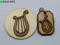 Size: 4000x3000 | Tagged: safe, artist:aracage, imported from derpibooru, lyra heartstrings, badge, cutie mark, irl, keychain, no pony, photo, pyrography, traditional art