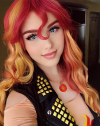 Size: 1440x1800 | Tagged: safe, artist:maddymoiselle, edit, editor:sammykun, imported from derpibooru, sunset shimmer, human, equestria girls, beautiful, bust, clothes, cosplay, costume, cutie mark, eyelashes, faceapp, female, gold, humanized, irl, irl human, jacket, jewelry, leather jacket, lipstick, looking at you, makeup, necklace, photo, photography, portrait, redhead, wig, woman
