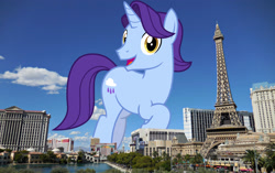 Size: 3072x1932 | Tagged: safe, artist:cheezedoodle96, artist:thegiantponyfan, edit, imported from derpibooru, november rain, pony, unicorn, friendship student, giant pony, giant unicorn, high res, highrise ponies, irl, las vegas, looking at you, macro, male, mega giant, nevada, open mouth, photo, ponies in real life, raised hoof, smiling, smiling at you, solo, stallion