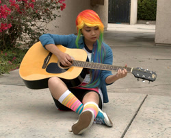 Size: 1392x1120 | Tagged: safe, artist:eri-nyan, imported from derpibooru, rainbow dash, human, equestria girls, 2015, clothes, cosplay, costume, guitar, irl, irl human, multicolored hair, musical instrument, photo, rainbow hair, solo