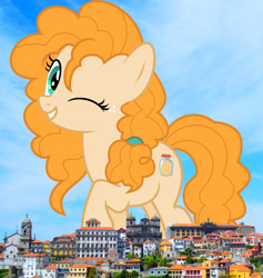 Size: 2658x2808 | Tagged: safe, artist:jhayarr23, artist:thegiantponyfan, imported from derpibooru, pear butter, earth pony, pony, female, giant pony, giant/macro earth pony, giantess, grin, high res, highrise ponies, irl, looking at you, macro, mare, mega giant, one eye closed, photo, ponies in real life, portugal, smiling, solo, wink
