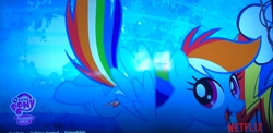 Size: 2937x1431 | Tagged: safe, imported from derpibooru, rainbow dash, pegasus, eyelashes, female, flying, logo, mare, netflix, photo, picture of a screen, solo