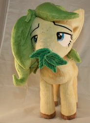 Size: 1580x2144 | Tagged: safe, artist:bastler, imported from derpibooru, oc, oc only, oc:nettle vienna, earth pony, pony, female, irl, leaves, mare, photo, plushie