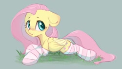 Size: 1200x675 | Tagged: safe, artist:melodylibris, imported from derpibooru, fluttershy, pegasus, pony, blushing, clothes, cute, female, floppy ears, grass, green background, looking back, lying down, mare, prone, shyabetes, simple background, socks, solo, sploot, striped socks