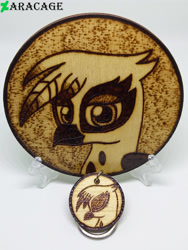 Size: 3000x4000 | Tagged: safe, artist:aracage, imported from derpibooru, gilda, griffon, bust, coaster, eyes closed, irl, keychain, looking at you, photo, portrait, profile, pyrography, traditional art