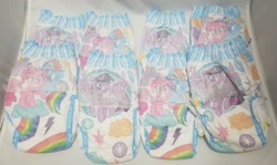 Size: 1600x956 | Tagged: safe, imported from derpibooru, pinkie pie, rainbow dash, twilight sparkle, alicorn, earth pony, pegasus, pony, diaper, female, mare, merchandise, pampers, pampers easy ups, photo, pullup (diaper), twilight sparkle (alicorn)