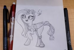 Size: 2439x1637 | Tagged: safe, artist:engi, imported from derpibooru, kerfuffle, pegasus, pony, rainbow roadtrip, amputee, clothes, female, happy, open mouth, pencil, pencil drawing, photo, pincushion, prosthetic leg, prosthetic limb, prosthetics, raised hoof, simple background, solo, traditional art