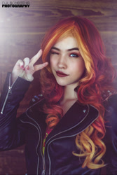 Size: 1125x1689 | Tagged: safe, artist:littlemissbloo, edit, editor:sammykun, imported from derpibooru, sunset shimmer, human, equestria girls, bust, clothes, cosplay, costume, faceapp, female, humanized, irl, irl human, jacket, leather jacket, live action, looking at you, one eye closed, peace sign, photo, photography, portrait, pose, redhead, solo, wink, wood