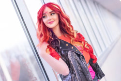 Size: 1080x720 | Tagged: safe, artist:sayakcos, edit, editor:sammykun, imported from derpibooru, sunset shimmer, human, equestria girls, blurry background, clothes, cosplay, costume, faceapp, female, glass, half body, humanized, indoors, irl, irl human, jacket, leather jacket, live action, photo, photography, smiling, solo, wig, window