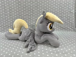 Size: 4032x3024 | Tagged: safe, artist:kazzysart, imported from derpibooru, derpy hooves, pony, irl, lying down, photo, plushie, prone, solo