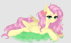 Size: 1280x787 | Tagged: safe, artist:sufflle, imported from derpibooru, fluttershy, pegasus, pony, aside glance, beige background, cheek fluff, ear fluff, female, flower, flower in hair, grass, grin, looking at you, lying down, mare, prone, simple background, smiling, solo, wings