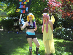 Size: 2828x2121 | Tagged: safe, artist:arcticshadowfox, imported from derpibooru, fluttershy, rainbow dash, human, 20% cooler, bare shoulders, belly button, clothes, converse, cosplay, costume, duo, everfree northwest, everfree northwest 2014, high res, irl, irl human, multicolored hair, photo, picket sign, rainbow hair, shoes, sports bra
