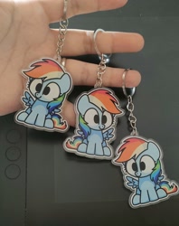 Size: 1842x2322 | Tagged: safe, artist:sugar morning, imported from derpibooru, rainbow dash, pegasus, pony, chibi, cute, dashabetes, female, g4, hand, irl, keychain, mare, merchandise, photo, sitting, solo