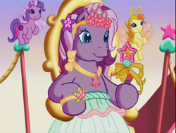 Size: 640x480 | Tagged: safe, imported from derpibooru, screencap, tiddlywink, wysteria, zipzee, breezie, earth pony, pony, the princess promenade, clothes, crown, dress, female, float, flower, g3, gown, holding, jewelry, mare, necklace, parade, princess wysteria, regalia, ribbon, sitting, smiling, stars, throne, wand, youtube link