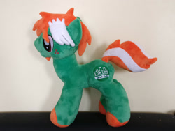 Size: 2828x2121 | Tagged: safe, artist:angelwarrioraurora, imported from derpibooru, oc, oc only, oc:towers, earth pony, pony, earth pony oc, freckles, galacon, irish, irl, logo, mascot, photo, plushie, solo, standing