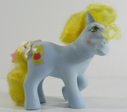 Size: 678x600 | Tagged: safe, imported from derpibooru, photographer:breyer600, cuddles (g1), earth pony, pony, blushing, bow, cuddledorable, cute, female, g1, irl, magic message ponies, mare, photo, tail, tail bow, teddi, teddibetes, toy