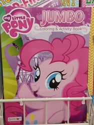 Size: 3000x4000 | Tagged: safe, imported from derpibooru, pinkie pie, earth pony, pony, coloring book, dollar tree, error, female, high res, irl, mare, my little pony jumbo coloring book, my little pony logo, open mouth, open smile, photo, raised hoof, smiling, solo